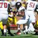 UMass running back and former Michigan player Mike Cox runs the ball in the first quarter against UMass at Michigan Stadium on Saturday. Melanie Maxwell I AnnArbor.com